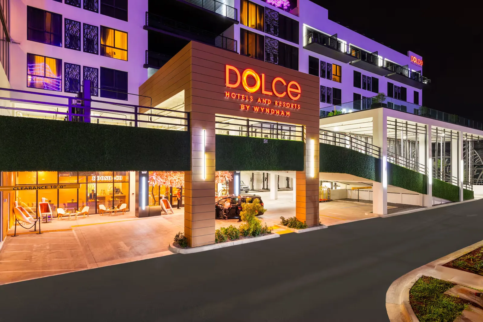 The lit entrance of the Dolce by Wyndham Hollywood at night