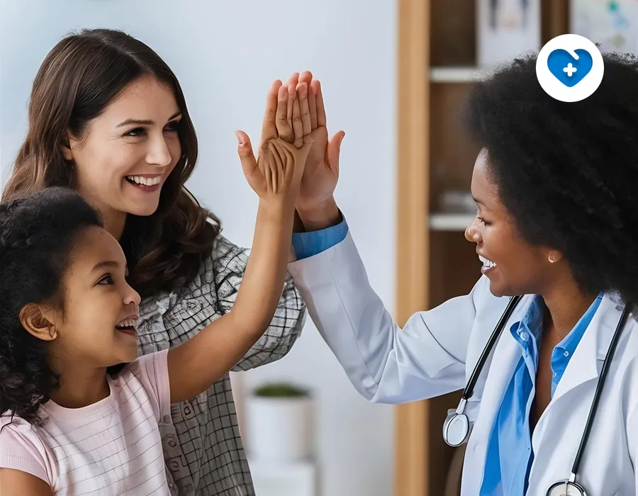 A mother and daughter high-fiving their doctor